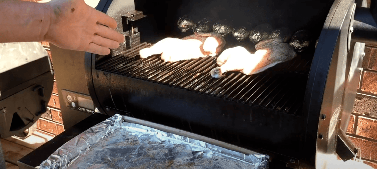 a man preparing chicken for grill on Pit Boss Pellet